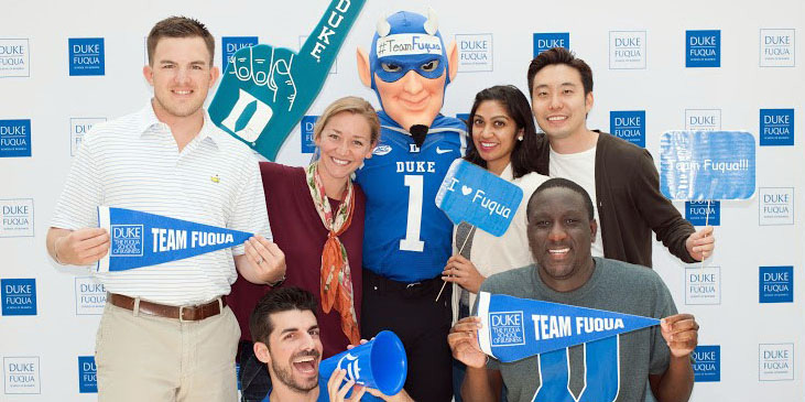 fuqua daytime mba students with the duke mascot