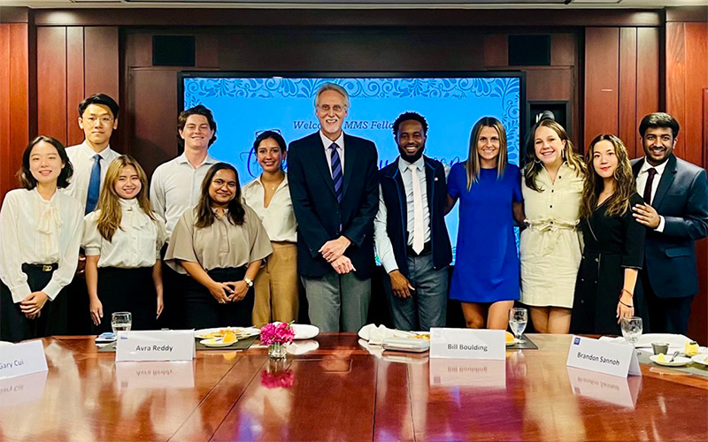fuqua dean and students