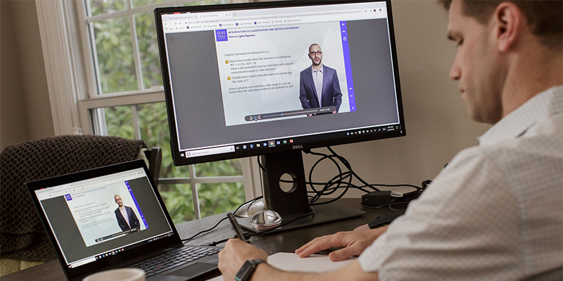 fuqua student at a computer